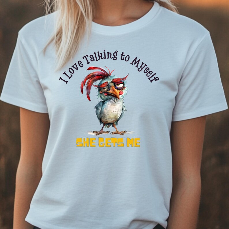May include: White t-shirt with a cartoon chicken and the text "I love talking to myself, she gets me".