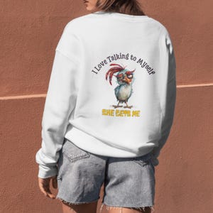 May include: White sweatshirt with a cartoon chicken wearing glasses and the text "I love talking to myself, she gets me".