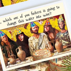 May include: A humorous birthday card with a group of people wearing party hats. The card has the text "So, which one of you fuckers is going to change this water into wine?" and "Happy Birthday Brian" on the image.