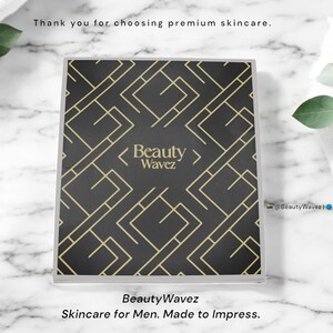 Beauty Wavez luxury skincare box flatlay with brand message “Skincare for Men. Made to Impress.” on marble background with spa towel and eucalyptus, styled for premium unboxing experience.