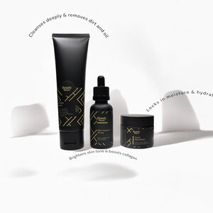Beauty Wavez skincare trio displayed on a white backdrop with minimal shadows and skincare benefit callouts, showcasing men's cleanser, serum, and moisturizer.