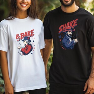 May include: A white t-shirt featuring a graphic of a historical figure in a red coat and blue hat with the text & BAKE, and a black t-shirt featuring a graphic of a bearded man in a blue coat and red hat with the text SHAKE, both with stars.