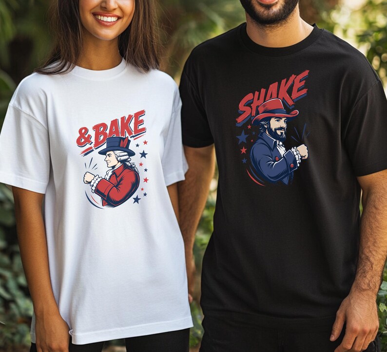 May include: A white t-shirt featuring a graphic of a historical figure in a red coat and blue hat with the text & BAKE, and a black t-shirt featuring a graphic of a bearded man in a blue coat and red hat with the text SHAKE, both with stars.