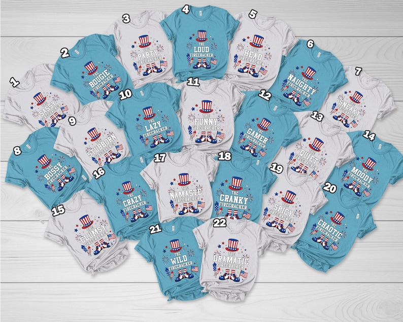 May include: A collection of twenty-two short-sleeved t-shirts in white and light blue, each featuring a graphic of a patriotic top hat, fireworks, and American flags, with unique text labels like The Bougie Firecracker and The Loud Firecracker.