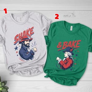 May include: A light gray t-shirt labeled 1 featuring a man in a red hat and blue coat with the text SHAKE and a green t-shirt labeled 2 featuring a man in a blue hat and red coat with the text & BAKE, both with red and blue star accents.