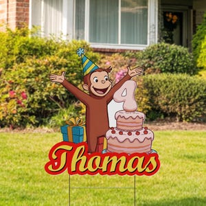 May include: A birthday yard sign featuring Curious George wearing a party hat and holding a present. The sign also includes a pink and white cake with a number 4 on top and the name "Thomas" in yellow letters.