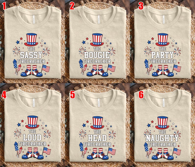 May include: A beige t-shirt featuring a graphic of a red, white, and blue top hat, fireworks, a rocket, and shoes. The text reads THE SASSY, BOUGIE, PARTY, LOUD, HEAD, or NAUGHTY FIRECRACKER. The design includes a small American flag illustration.