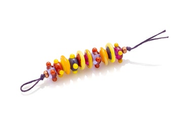 strand of 10 purple, gold & yellow beads