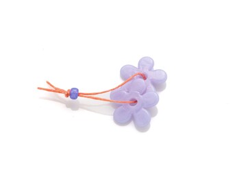 two lavender flat flower beads