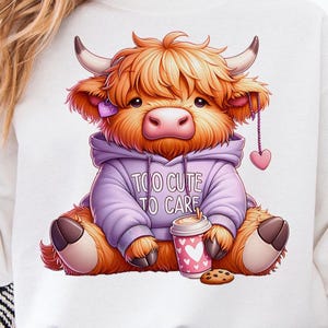May include: A digital illustration of a Highland cow wearing a purple hoodie with the text "Too Cute To Care." The cow is holding a coffee cup with hearts and a cookie. The cow has fluffy orange fur, small horns, and a pink nose.