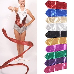 May include: A red, white, and blue sequined leotard with a white skirt and a red ribbon. The ribbon is being twirled by a person. The image also shows a variety of colors of ribbons, including red, blue, gold, silver, black, purple, green, and pink.