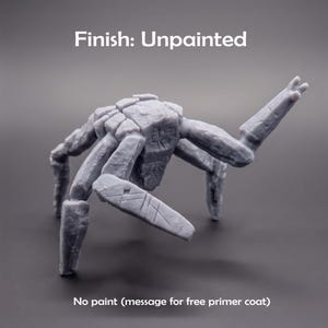 May include: A grey, unpainted resin miniature of a multi-legged creature with a textured, stone-like body. The text 'Finish: Unpainted' appears at the top, and 'No paint (message for free primer coat)' is printed at the bottom of the image.