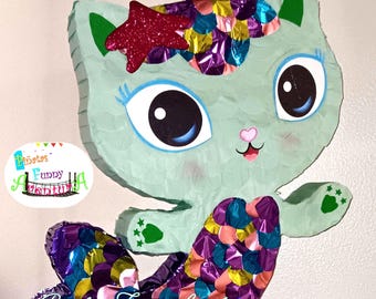 Mermaid, kitty, Gabby's dollhouse piñata, for a birthday party. Gabby's dollhouse piñata, for a birthday party.