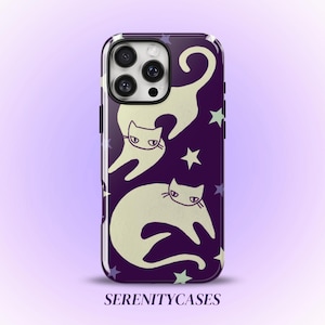 May include: A dark purple smartphone case featuring a pattern of two cream-coloured cats and several small stars in light green and purple. The text SERENITYCASES is printed in dark purple at the bottom of the phone case design.