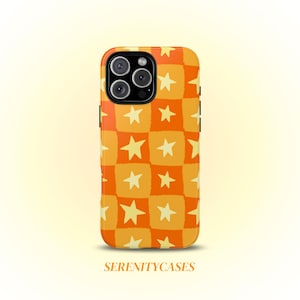 May include: A phone case in orange and yellow, patterned with stars and squares. The case has a shiny finish and the text "SERENITYCASES" is at the bottom.