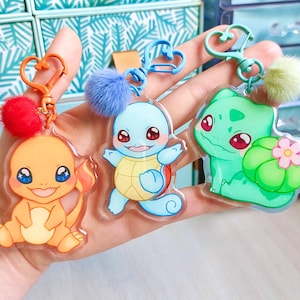 Charmander, Squirtle und Bulbasaur – Glitzernde Acryl-Schlüsselanhänger