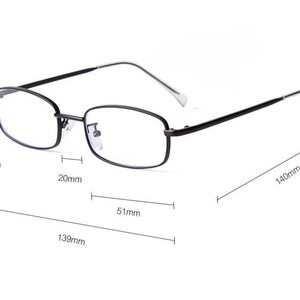 May include: Black rectangular eyeglasses with clear lenses. The frame is 139mm long, 30mm high, and 20mm wide. The lens width is 51mm, and the temple length is 140mm. The glasses have a minimalist design.