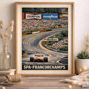 May include: Framed vintage racing poster featuring a Formula 1 car on the Spa-Francorchamps track. The poster includes sponsor logos for Champion, Goodyear, and Marlboro. The text "SPA-FRANCORCHAMPS" is displayed at the bottom.