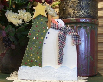Do you see what I see? Snowman with Christmas Tree