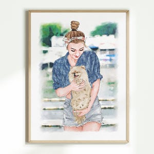 May include: Watercolour portrait of a person holding a fluffy, light brown Pomeranian dog. The person wears a blue plaid shirt and denim shorts. The artwork is framed in a light wood frame.