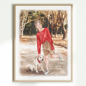May include: Watercolour painting of a person in a red long-sleeved top and brown shorts, smiling next to a white dog with a red bandana. The artwork is framed in a light wood frame.