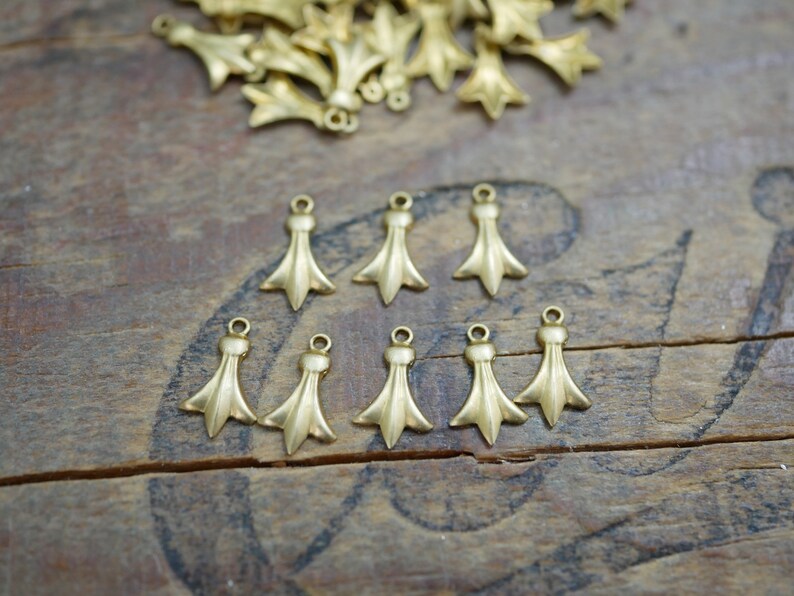 #06733 8 pieces Small Brass Drop Dangle Fleur De Lis Drop 12x6mm Made in the USA