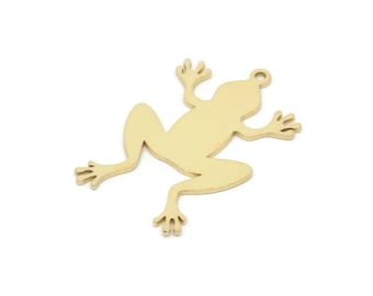 May include: Gold-colored metal frog charm with a smooth, flat surface. The frog is facing right and has a hole at the top for attaching to a chain or other jewelry.