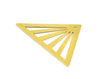 May include: A gold-colored metal triangle with a sunburst design cut out. The triangle has a small hole at the top.