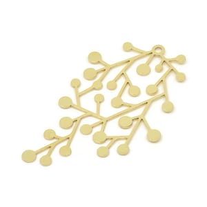 May include: Gold metal pendant shaped like a branch with many small circles. The pendant is a delicate and intricate design.
