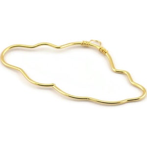 May include: A gold-colored, cloud-shaped wire earring with a twisted wire loop at the top.