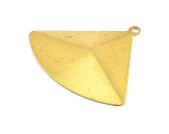 May include: A gold-toned metal pendant shaped like a triangle with a rounded bottom edge. The pendant has a small loop at the top for attaching a chain or cord.