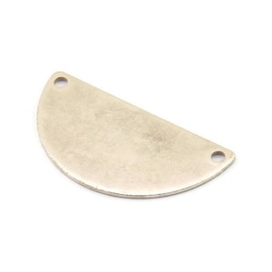 May include: A silver half-circle charm with two holes for attaching to jewelry or other crafts.