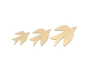 May include: Three gold-colored bird-shaped charms in varying sizes. Each charm has a hole for stringing and a simple, stylized design. The birds are arranged in a row, suggesting flight or progression. Ideal for jewelry making or crafting.