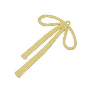 May include: A gold-colored metal bow with a long, thin tail. The bow is a decorative element that can be used for crafting or jewelry making.