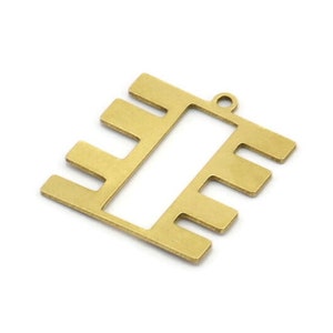 May include: Gold-toned metal charm with a rectangular shape and a cutout in the center. The charm has five vertical bars on each side of the cutout.