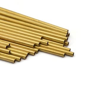 May include: A bundle of gold-coloured brass tubing, stacked and arranged in a diagonal pattern. The tubing is smooth and shiny, with a consistent diameter.
