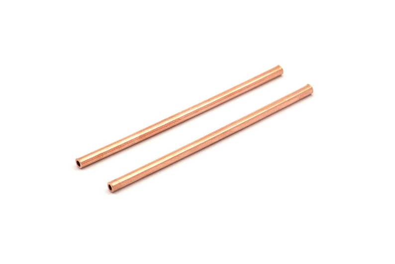May include: Two copper tubes, each approximately 15 cm long, with a smooth, polished finish.