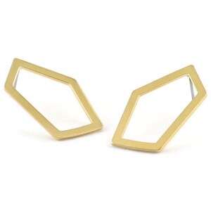 May include: A pair of gold geometric earrings with a diamond shape.