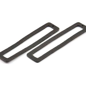 May include: Two dark grey rectangular metal jewellery components with a textured surface. Each component has a rectangular opening and a small hole at one end, suitable for stringing or connecting to other pieces.