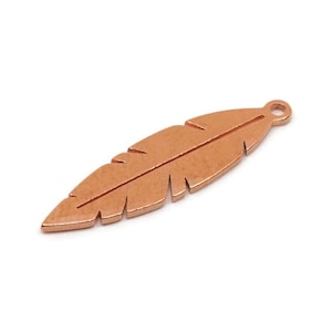 May include: A copper-colored feather charm with a small loop at the top for attaching to jewelry. The feather has a detailed design with etched lines and a textured surface. The charm is isolated on a white background.