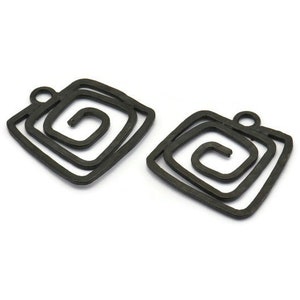 May include: Two black metal charms with a square shape and a spiral design. The charms have a hole at the top for attaching to a necklace or bracelet.