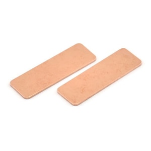 May include: Two rectangular copper heat sinks, each with a slightly textured surface.