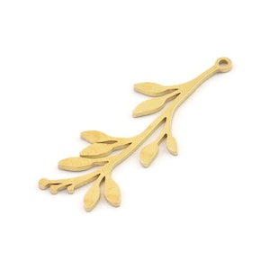May include: A gold-coloured metal charm in the shape of a leafy branch with a loop at the top for attaching to jewellery or other crafts.
