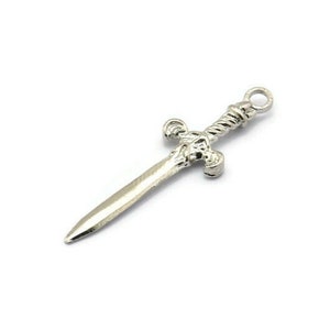May include: A silver sword charm with a twisted handle and a detailed hilt.