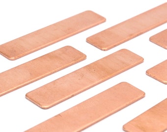 May include: Eight rectangular copper plates, arranged in a staggered pattern on a white background.