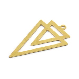 May include: Gold-toned metal pendant featuring a double triangle design with a loop for attaching a chain or cord.
