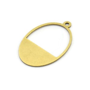 May include: A gold-toned metal oval pendant with a cut-out section in the top half. The pendant has a loop at the top for attaching to a chain or cord.