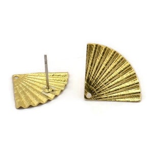 May include: A pair of gold-tone fan-shaped earring blanks with a post and a hole at the top. The fan design has a textured surface.