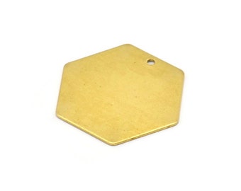 May include: A gold-colored hexagonal charm with a small hole at the top.