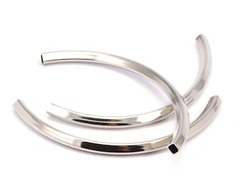 May include: Three silver metal hoops, each with a slightly different diameter, are stacked on top of each other. The hoops are smooth and shiny.